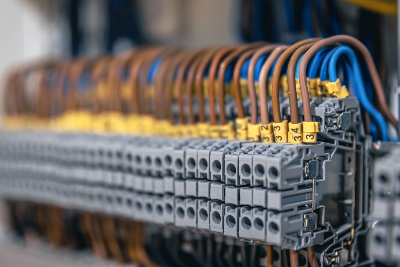 Voltage distributor with automatic switches. Electrical background.